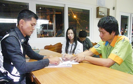 Purom Uttha signs his name to the guilty charge before being left off with a warning.